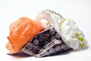 Carrier bag producers claim that a levy on single use carrier bags is being backed to 'fill a hole' in charity income